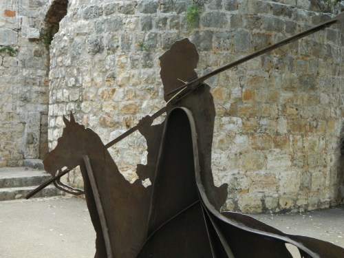 Metal silhouette against fortress wall