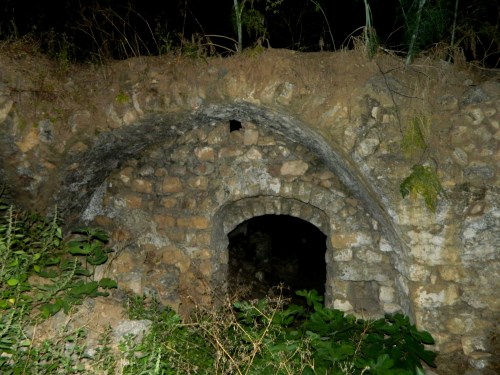 A section of wall in the darkness of night