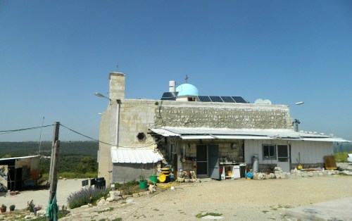 Iqrit church with house