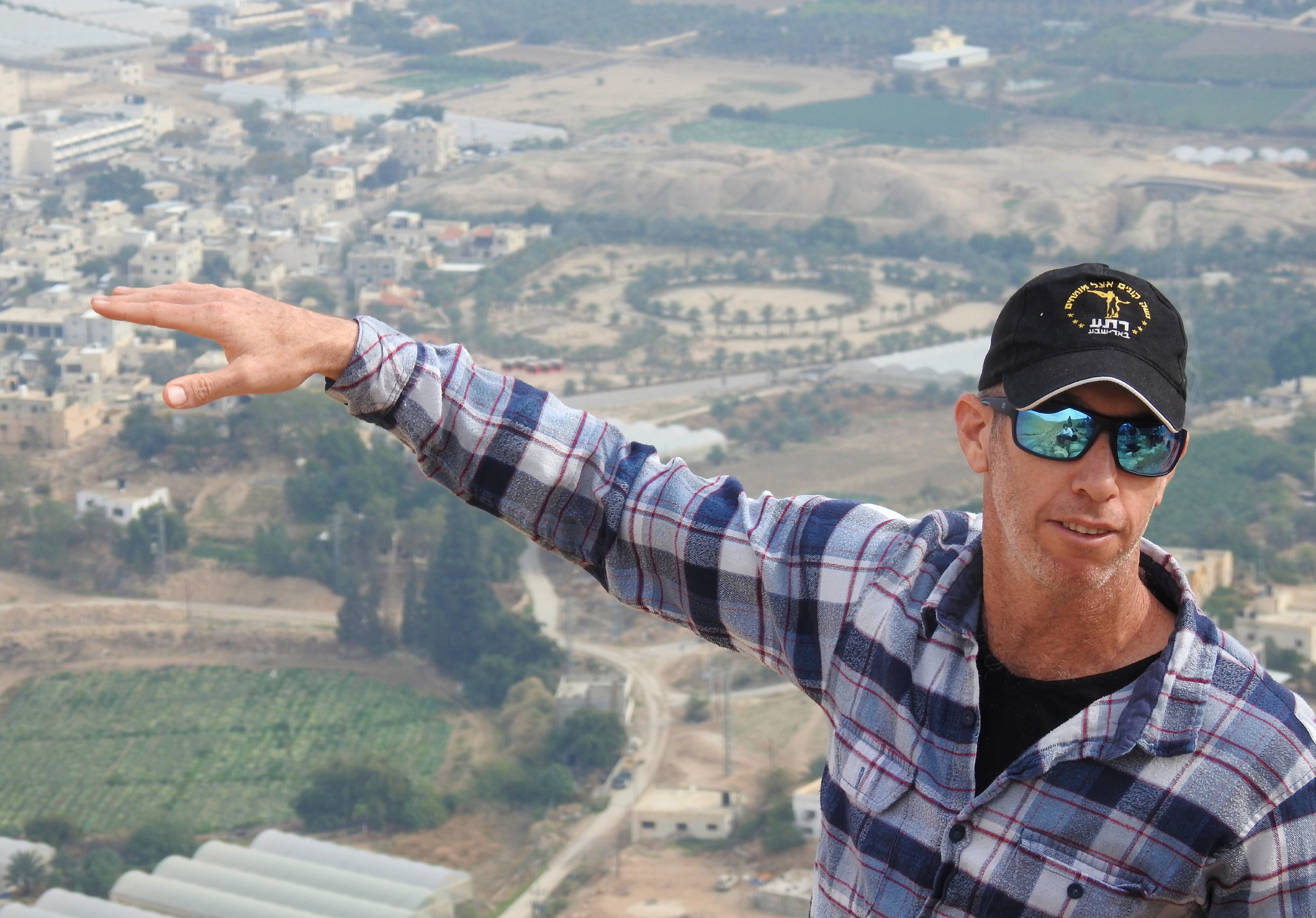 Dr Dvir Raviv backdropped by ancient Jericho